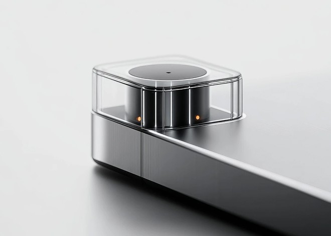 Design Intelligence, a compact glass-topped device on a metal rail